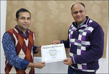 Dr. Vikram Chauhan (MD-Ayurveda) Presenting Certificate of Distributorship to Mr. Ashraful Karim (Distributor in Bangladesh) at Planet Ayurveda Centre